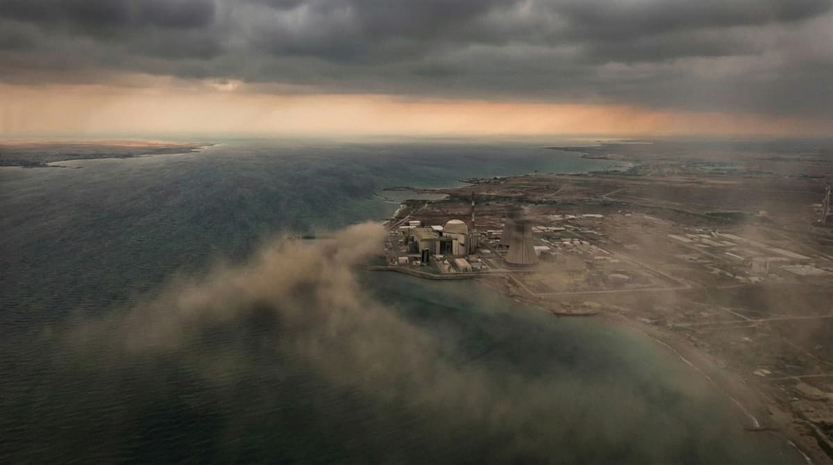 Aerial view of Bushehr nuclear power plant on the Persian Gulf coastline under stormy skies